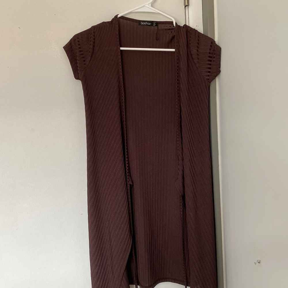 Wrap dress it ties… never worn.. purplish brown color size US4